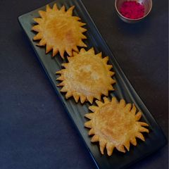 A picture of Baked Padma Luchi.
