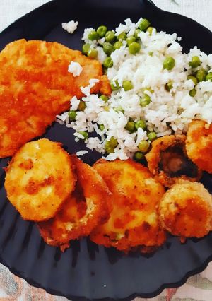 A picture of Fried Veggies and Meat With Green Pea Rice.