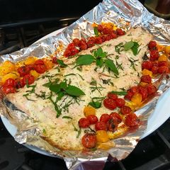 A picture of Super Easy Roasted Lemon Dill Salmon with Basil Tomatoes.