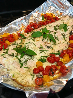 A picture of Super Easy Roasted Lemon Dill Salmon with Basil Tomatoes.