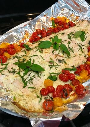 A picture of Super Easy Roasted Lemon Dill Salmon with Basil Tomatoes.