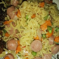 A picture of Noodles with sausage and veggies.