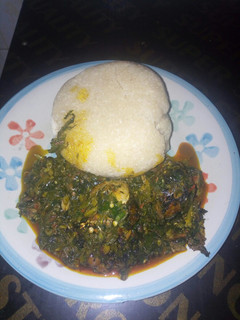 A picture of Vegetable and garri swallow.