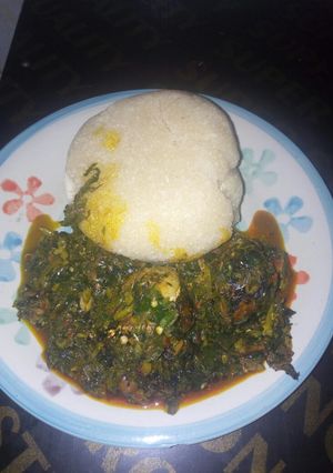 A picture of Vegetable and garri swallow.