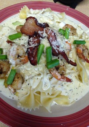 A picture of Shrimp and bacon cheesy Alfredo.