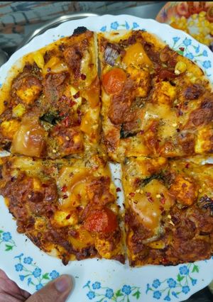 A picture of Paneer Tikka Pizza.