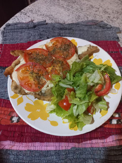 Una foto de Milanesa de pollo napolitana