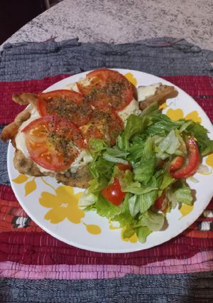 Una foto de Milanesa de pollo napolitana