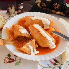 A picture of Stuffed cabbage in tomato sauce.
