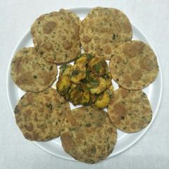 A picture of Aloo puri (Crispy maithi (fenugreek) puri with spicy potato in maggi masala.).