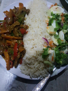 A picture of Rice with shredded beef sauce.