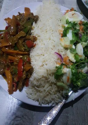 A picture of Rice with shredded beef sauce.