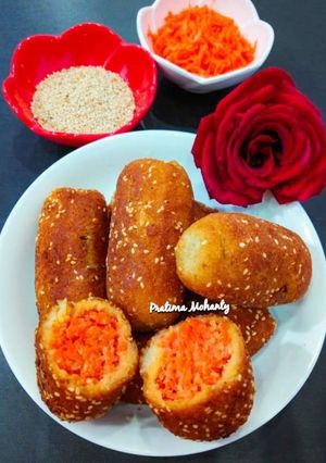 A picture of Carrot Stuffed Sesame Bread Roll.