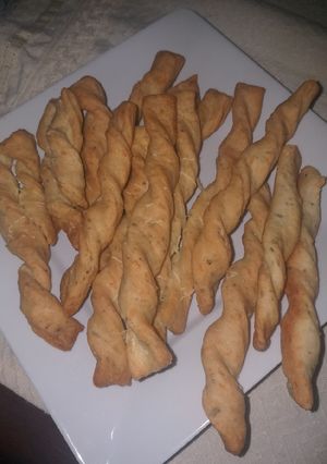 Una foto de Palitos de 🧀 y orégano