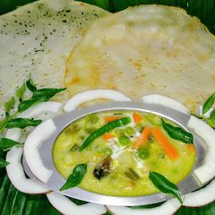 Appam with vegetable stew A picture of Appam with vegetable stew.