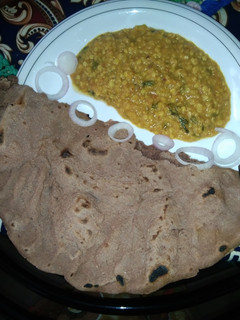 A picture of Matar daal with chawal ki roti.