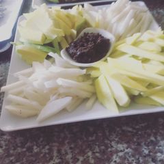 A picture of Fresh fruit fries and Shrimp paste or bagoong dip.