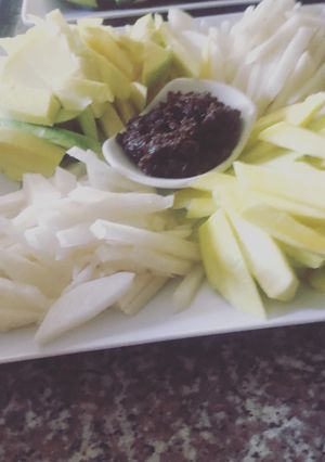 A picture of Fresh fruit fries and Shrimp paste or bagoong dip.