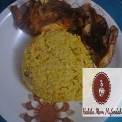 Tumeric Jallop Rice with chicken wings A picture of Tumeric Jallop Rice with chicken wings.