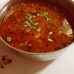 A picture of Aloo in Tomato Gravy.