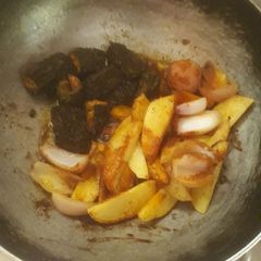 A picture of Bitter gourd potato and onion masala  sabji.
