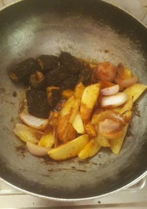 A picture of Bitter gourd potato and onion masala sabji.