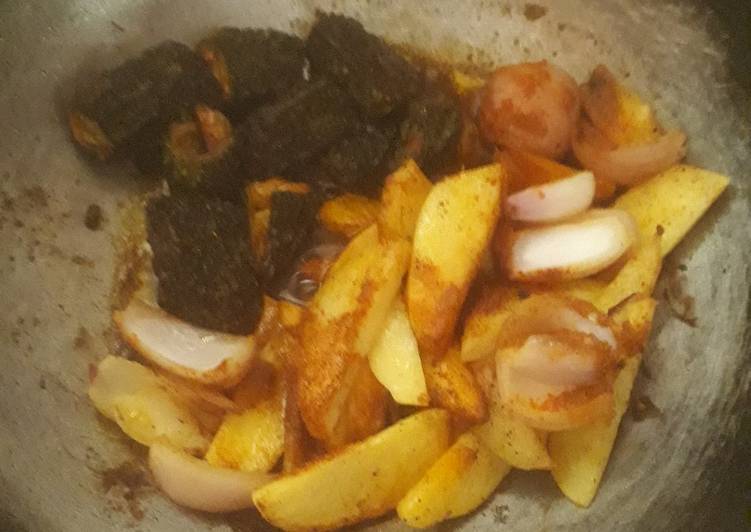 Recipe of Quick Bitter gourd potato and onion masala  sabji