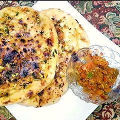 A picture of Patato filling Tawa naan😋.