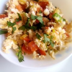 A picture of Simple scrambled eggs with onions, tomatoes and capsicum.