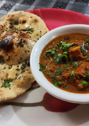 A picture of Matar paneer dhaba style with wheat flour butter naan.