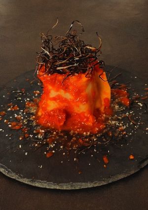 A picture of Lasagna Rosettes with Eggplant, Taggiasca Olives, and Turmeric.