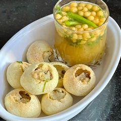 Orange 🍊 Pani With Roasted Puri & Potato 🥔 Chana Filling A picture of Orange 🍊 Pani With Roasted Puri & Potato 🥔 Chana Filling.