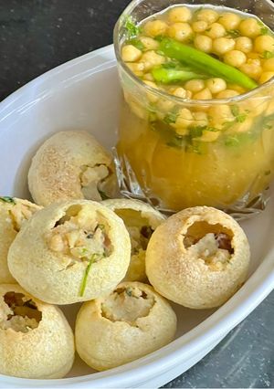 A picture of Orange 🍊 Pani With Roasted Puri & Potato 🥔 Chana Filling.