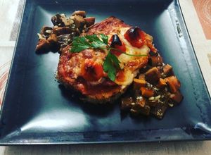 Foto principal de Milanesa de berenjena a la napolitana con bolets al ajillo de guarnición