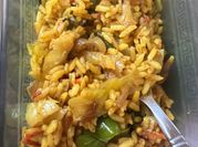 A picture of chicken fried rice with vegetables