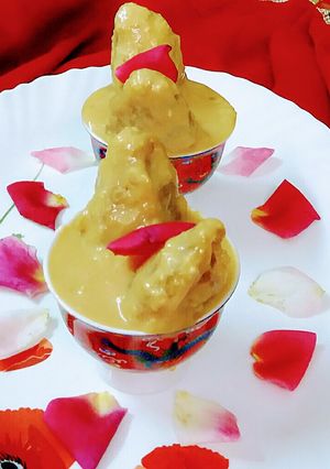 A picture of Aata dudh puli or coconut stuffed whole wheat rice dumpling.