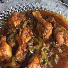 A picture of Chicken wings with green paper (shimla Mitch) iftar special.