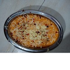 A picture of Macaroni in Red Sauce.
