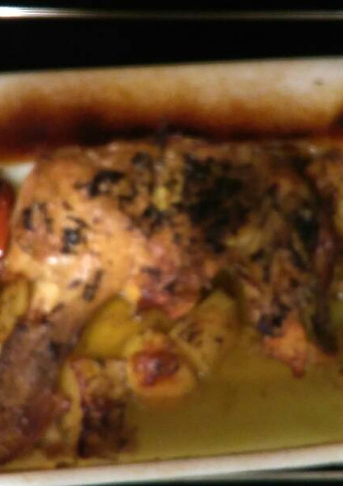 Una foto de Muslo y contra muslo de pollo al horno