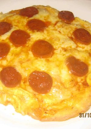 Una foto de PizzaHuevo de chorizo