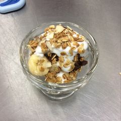 A picture of Raw Chocolate Banana Mousse Parfait with Coconut Whip Cream and Vanilla Almond Granola.