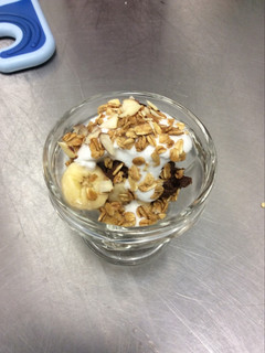 A picture of Raw Chocolate Banana Mousse Parfait with Coconut Whip Cream and Vanilla Almond Granola.