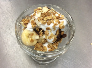 A picture of Raw Chocolate Banana Mousse Parfait with Coconut Whip Cream and Vanilla Almond Granola.