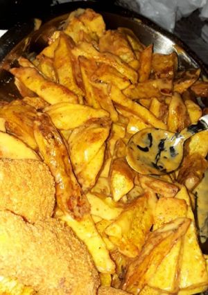 Una foto de Súper papas rústicas con cheddar!