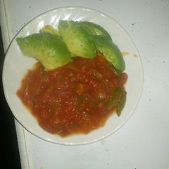 A picture of Tomato soup and avocado.
