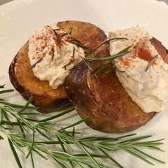 A picture of Butternut Squash Steaks Topped with Caramelised Onion Hummus.