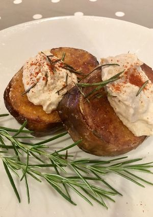 A picture of Butternut Squash Steaks Topped with Caramelised Onion Hummus.