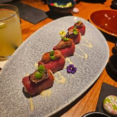 A picture of Sushi with truffle and red tuna and foie gras.
