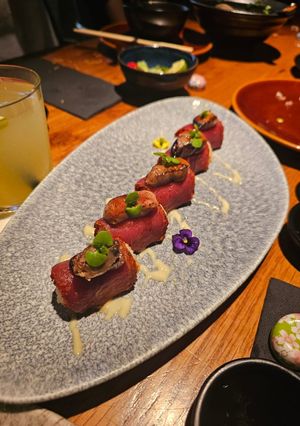 A picture of Sushi with truffle and red tuna and foie gras.
