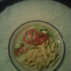 A picture of Green salad and chips.